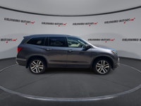 This used 2018 Honda Pilot Touring AWD is a roomy, family-ready SUV with smart features and proven V... (image 8)