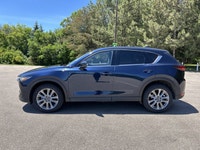 Finished in blue with a black interior, this used 2021 Mazda CX-5 GT AWD brings together upscale com... (image 9)