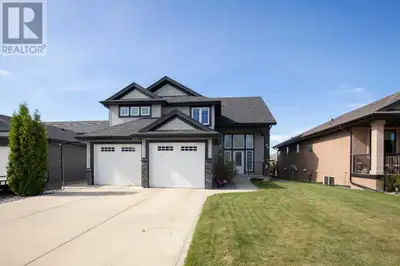 Welcome to 56 Emily Crescent, a charming home nestled in a desirable Lacombe neighborhood. This invi...