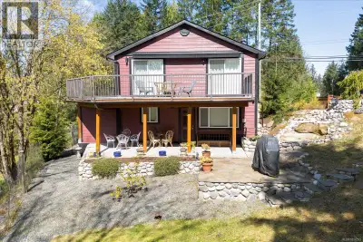 Small acreage in the City! This little piece of heaven is perched at the top of a hill providing lov...