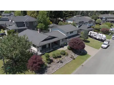 LOCATION, LARGE LOT & LIGHT! Original home on an over 10,000 sq ft CORNER LOT with natural light pou...