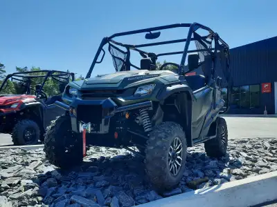 The 2025 Honda Pioneer 1000-5 Trail Edition offers the same powerful 999cc performance and five-pass...