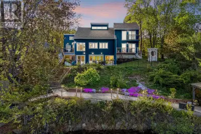 Welcome to the exquisite lakefront property at 51 Eagle Point Drive, nestled on a peaceful cul-de-sa...