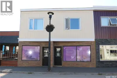 Here is a great opportunity to invest in! Main floor commercial space with two one bedroom apartment...