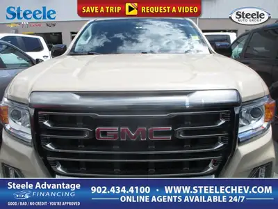 Finished in Desert Sand Metallic with a Black interior, this 2022 GMC Canyon 4wd At4 Cloth brings mi...