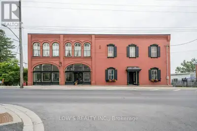 Commercial Opportunity - Prominent In-Town Victorian Brick Building with additional commercial lot....