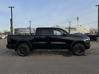 This 2026 RAM 1500 REBEL CREW CAB 4X4 has the following options Lux Leather Trimmed Bucket Seats, Re... (image 6)