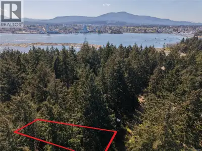 Protection Island building lot, 9000 sqft in the forest, with undeveloped parkland behind. Tucked in...