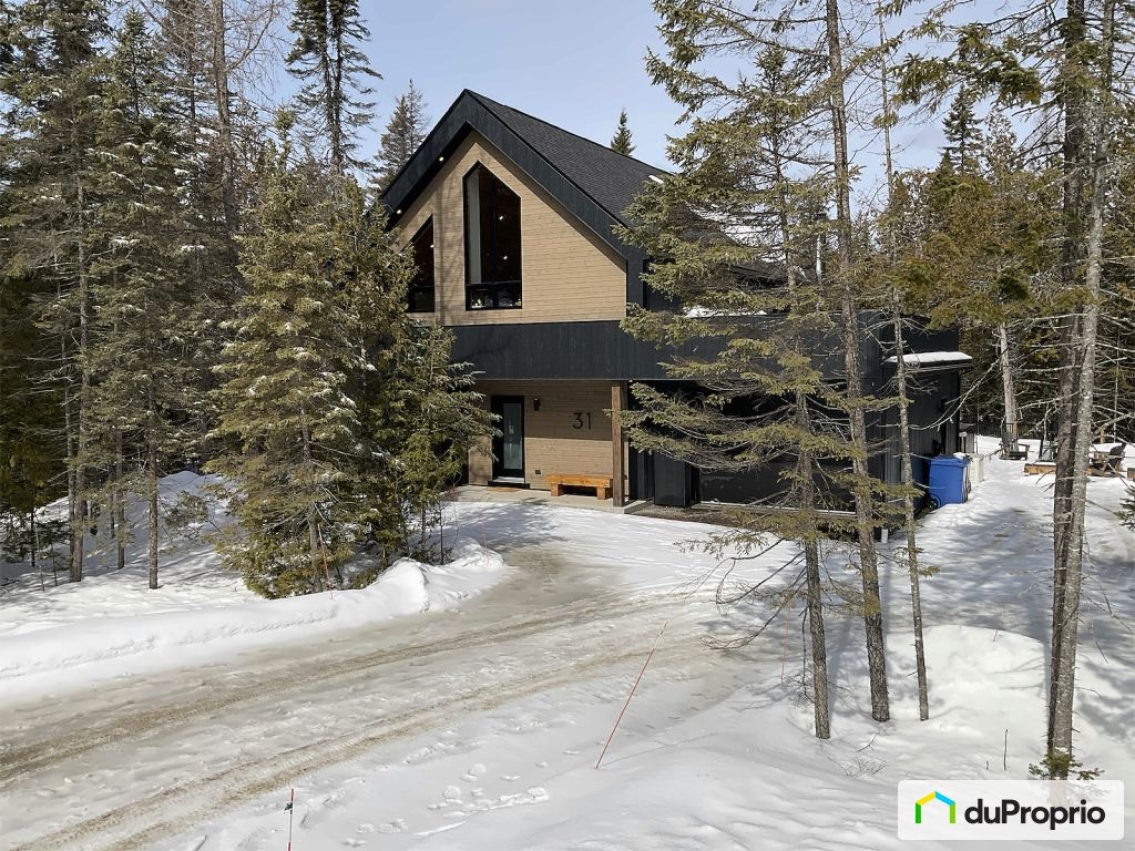 $947,000 - Cottage for sale in St-Côme — photo 1