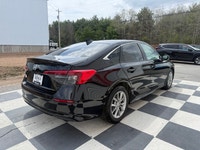 A modern and efficient compact sedan with a refined interior, advanced safety features, and smooth t... (image 3)