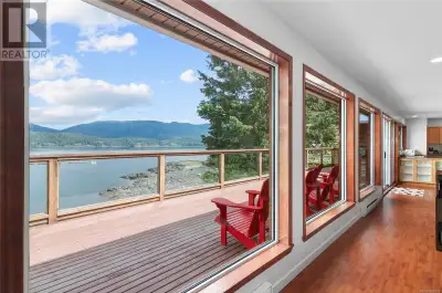 Fully furnished turn key oceanfront bungalo featuring a wall of windows that give a cruise ship like...