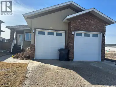 Welcome to SaskValley! This lovely bungalow boasts an open concept floor plan that is warm and invit...