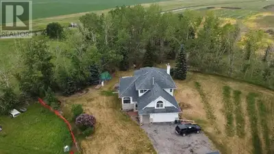 Welcome to this spacious & private acreage retreat located southeast of Chestermere & west of Langdo...