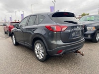 This 2015 Mazda CX-5 GT AWD is a sporty crossover that's smoother than a twisty backroad and comfier... (image 1)