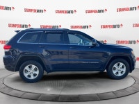 This outstanding example of a 2015 Jeep Grand Cherokee Laredo is offered by Stampede Auto. The Jeep... (image 5)