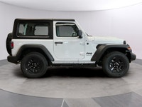 The 2026 Jeep Wrangler Sport 2 Door 4x4, presented in a striking white color, is equipped with a res... (image 5)