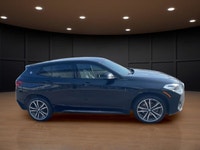 The 2022 BMW X2 xDrive28i Sports Activity Coupe in a sophisticated black finish and equipped with BM... (image 4)