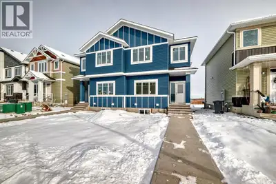 Welcome to this spacious and thoughtfully designed duplex in the charming town of Crossfield, Albert...