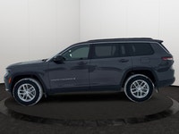 This 2025 JEEP GRAND CHEROKEE L LAREDO 4X4 has the following options Cloth Seats, Power Sunroof, Rem... (image 1)