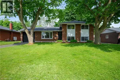 Mid-Century Living on a quiet Cambridge Court! This solid, brick-and-siding family home sits on a ge...