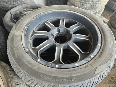 Set of four 265/50R20 Uni Glory all-season tires mounted on 20-inch wheels, previously used on a 200...