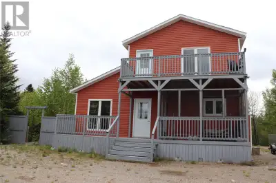 This stunning 2 bedroom, 1 bath cottage sits on a large lot with a stream flowing along the edge of...