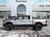 Dominate every road and task in this robust 2021 Ram 1500 Rebel Crew Cab Pickup. Dressed in striking... (image 2)