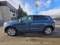 This 2016 Ford Edge SEL finished in Blue with a Black interior pairs a peppy EcoBoost 2.0L Turbo I4... (image 3)
