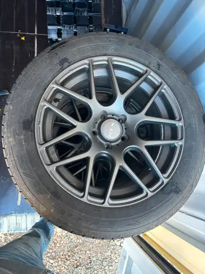 2 year old rims and tires for sale with lug nuts Came off 2012 ford Escape, roughly 10,000kms on the...