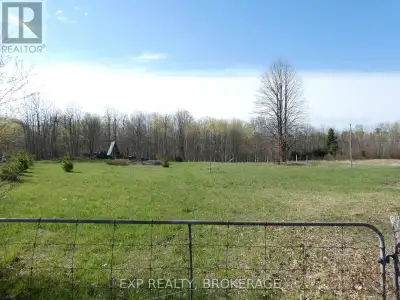 This beautiful 4.78-acre lot is ideal for your future home! A gated entrance and tree line along the...