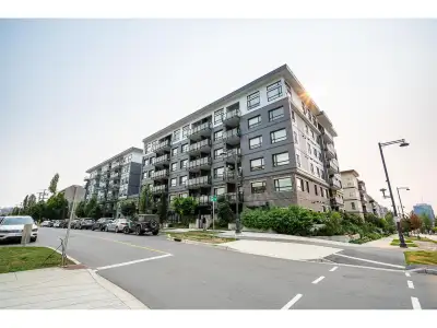 Welcome to Q5! Step into a warm, 2-bed penthouse sanctuary where soaring 10'6" ceilings and expansiv...