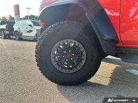 Unleash the beast within. This 2022 Ford Bronco Raptor, a Code Orange convertible with a Black Onyx... (image 9)
