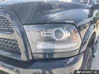The 2016 Ram 2500 Laramie, finished in an elegant black exterior paired with a sophisticated black i... (image 7)
