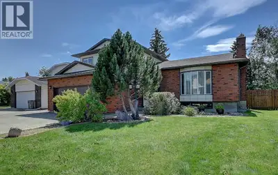 The stunning red brick façade is just the beginning of everything this exceptional home has to offer...