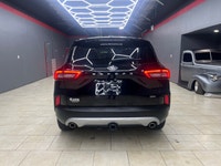 The 2024 Ford Escape in the elegant Black finish coupled with a Front-Wheel Drive system offers an e... (image 6)