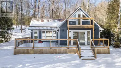 Escape to your own slice of paradise with this stunning, fully renovated cottage on the serene shore...