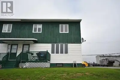 This 3 bedroom, 1 bath townhouse is an end unit and is situated on a large lot, with a 12 X 24 Garag...