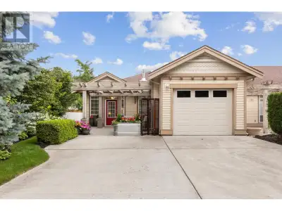Welcome to this pristine end-unit townhome located just one block from endless beach and lake enjoym...