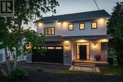 Overlooking Lake Charles, 28 Joaquina Court seamlessly blends modern elegance with advanced energy e...