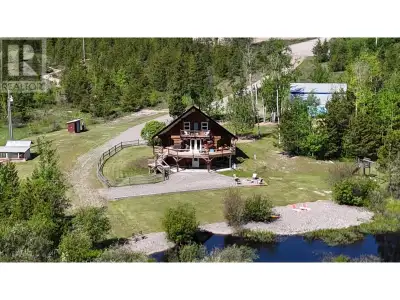 Fully renovated chalet style log home on 86 private acres with an amazing waterfront view of your ow...