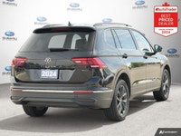 New Price! Odometer is 13972 kilometers below market average! Deep Black Pearl 2024 Volkswagen Tigua... (image 4)