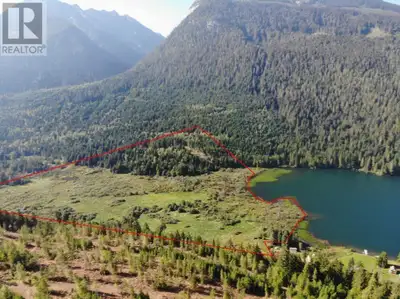 A scenic backcountry acreage fronting on Staubert Lake, a prime fishing lake in the Selkirk Mountain...