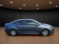 The 2021 Toyota Corolla LE in sleek gray with its reliable front-wheel drive and automatic transmiss... (image 4)
