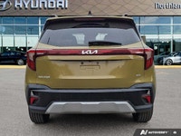 Embrace the thrill of the open road with this 2024 Kia Seltos EX, a vibrant green SUV boasting a rem... (image 3)