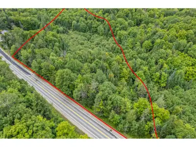 Beautiful wooded lot of over 4.8 acres near Val-des-Monts Town Hall, less than 20 minutes from Gatin...