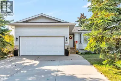 Welcome to this spacious and well-maintained bungalow located in the heart of Crossfield, close to s...