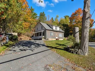 Attention investors and renovators! Property with great potential! Large lot of over 10,000 sq. ft....