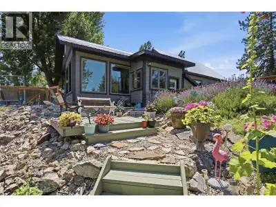 **One-of-a-kind riverfront property! Move-in Ready!** Set on just over one acre, the home is perched...