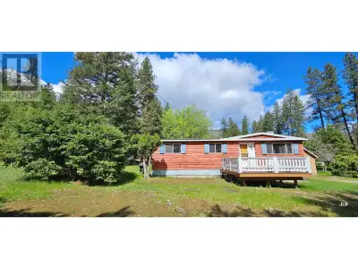 Here is a small 1.47 acre property on the edge of Rock Creek, with a 3 bedroom, 1 bath older mobile...