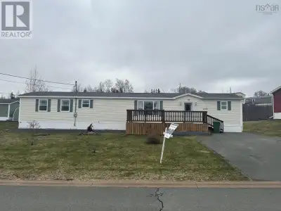 Move in condition best describe this beautiful mini home located on a very large landscaped rented l...